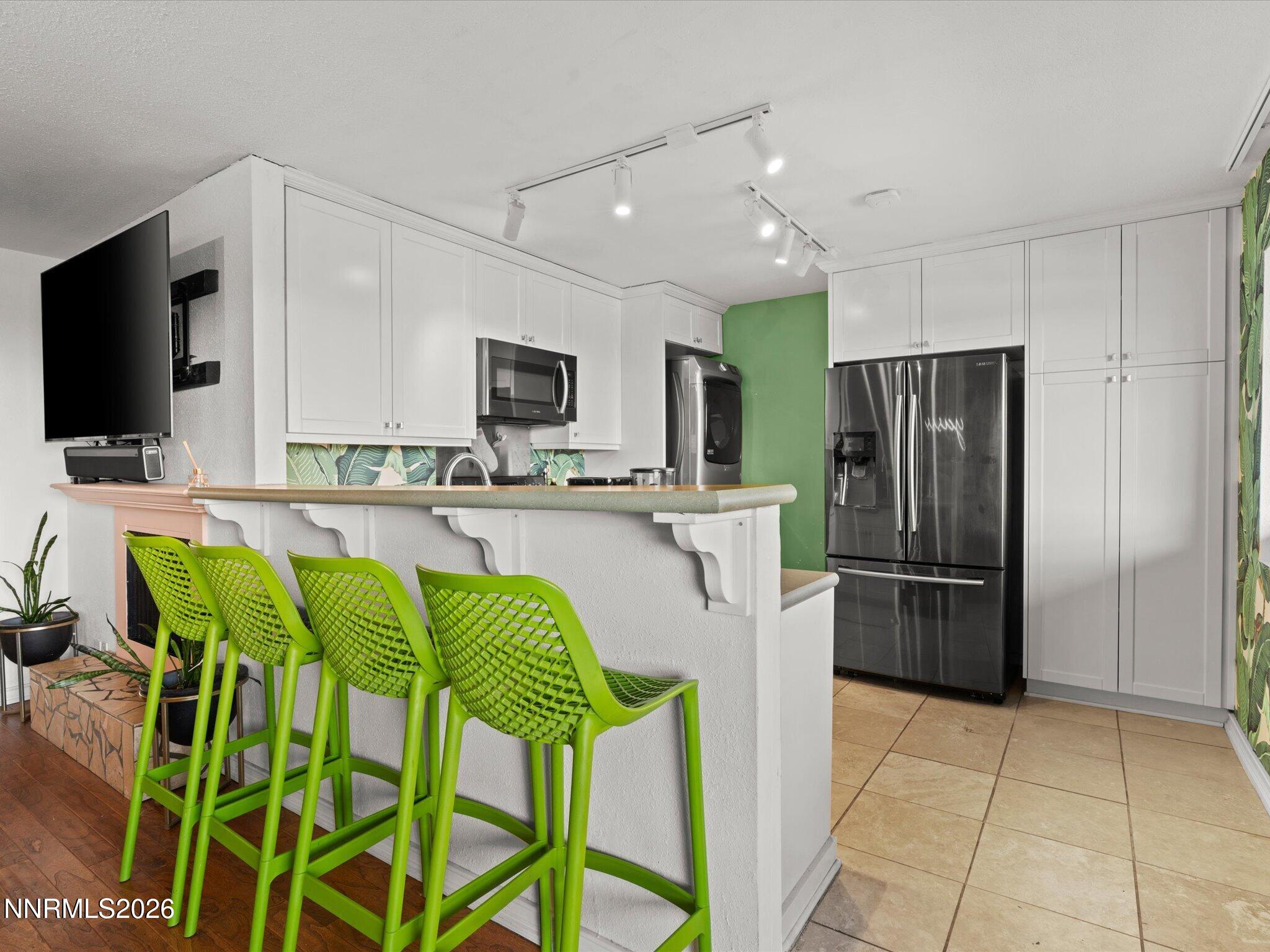 3149 Cashill Boulevard Reno, NV 89509 - Photo 22 of 44 a kitchen with stainless steel appliances a refrigerator sink and microwave
