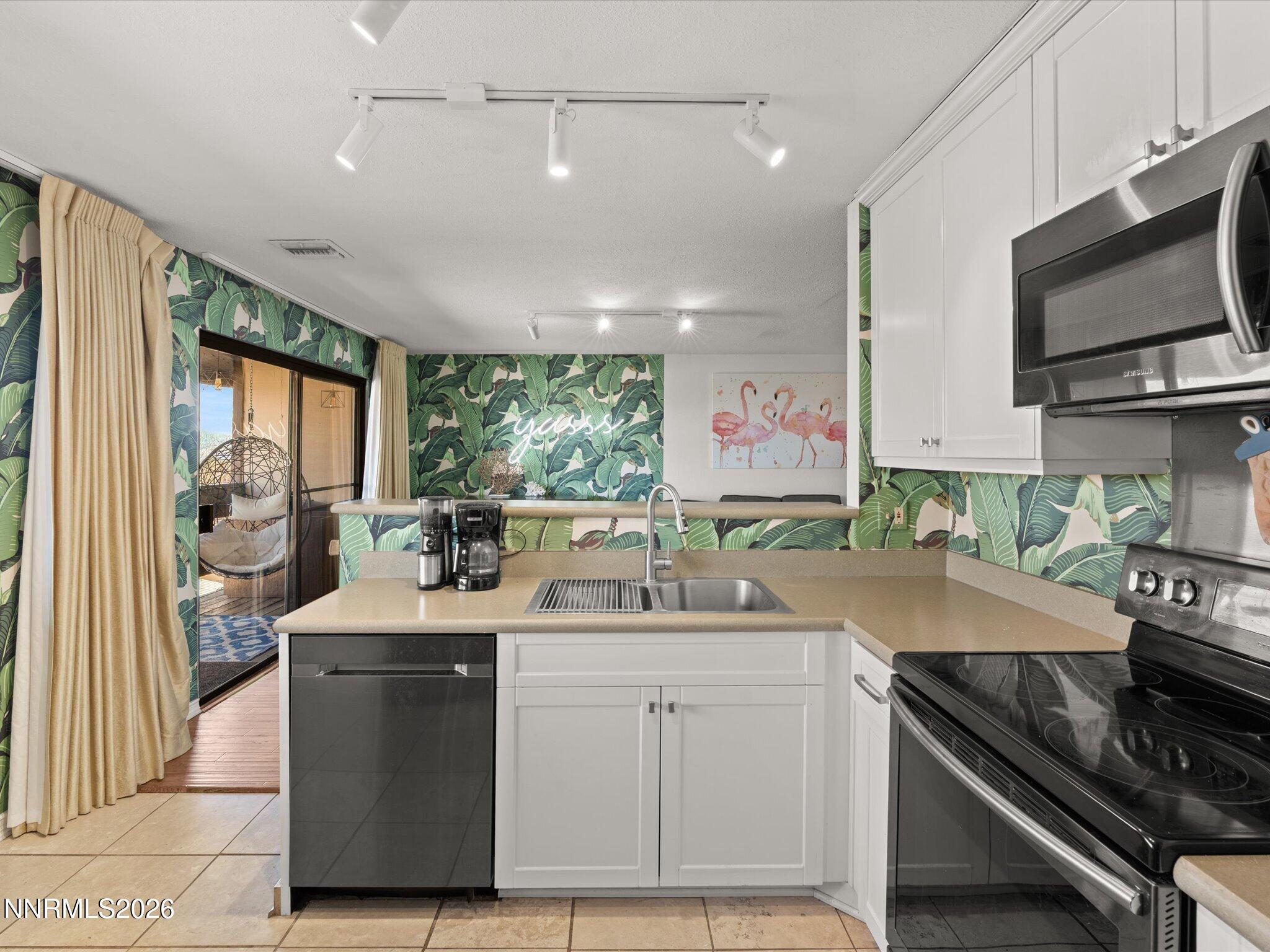 3149 Cashill Boulevard Reno, NV 89509 - Photo 25 of 44 a kitchen with a sink stove and cabinets