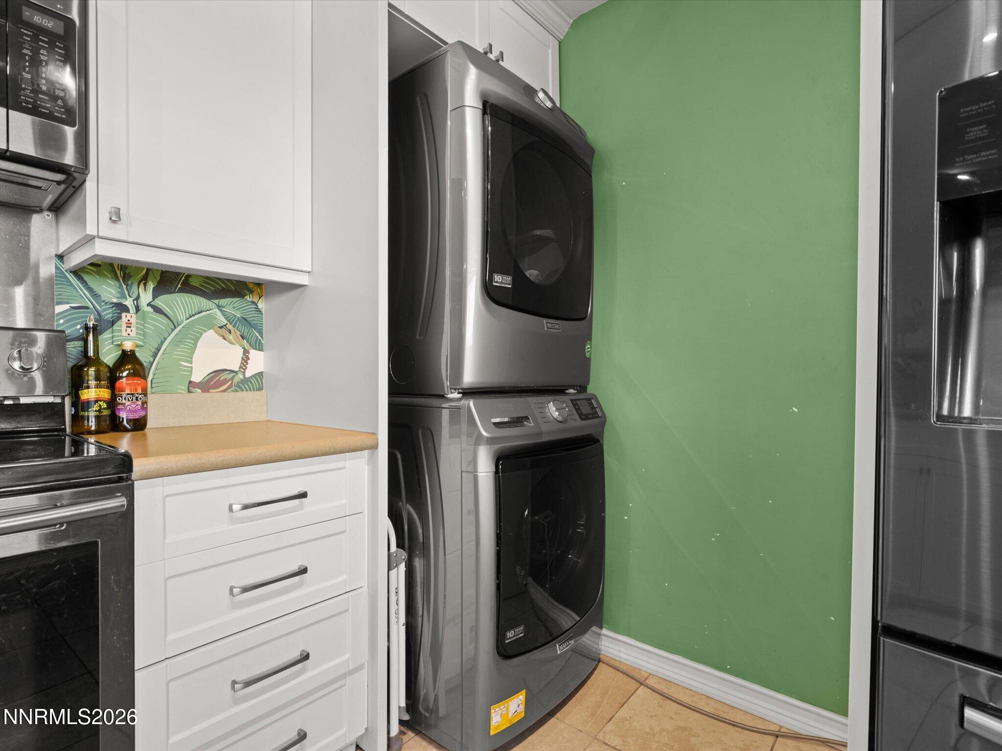 3149 Cashill Boulevard Reno, NV 89509 - Photo 27 of 44 a kitchen with stainless steel appliances a refrigerator and cabinets