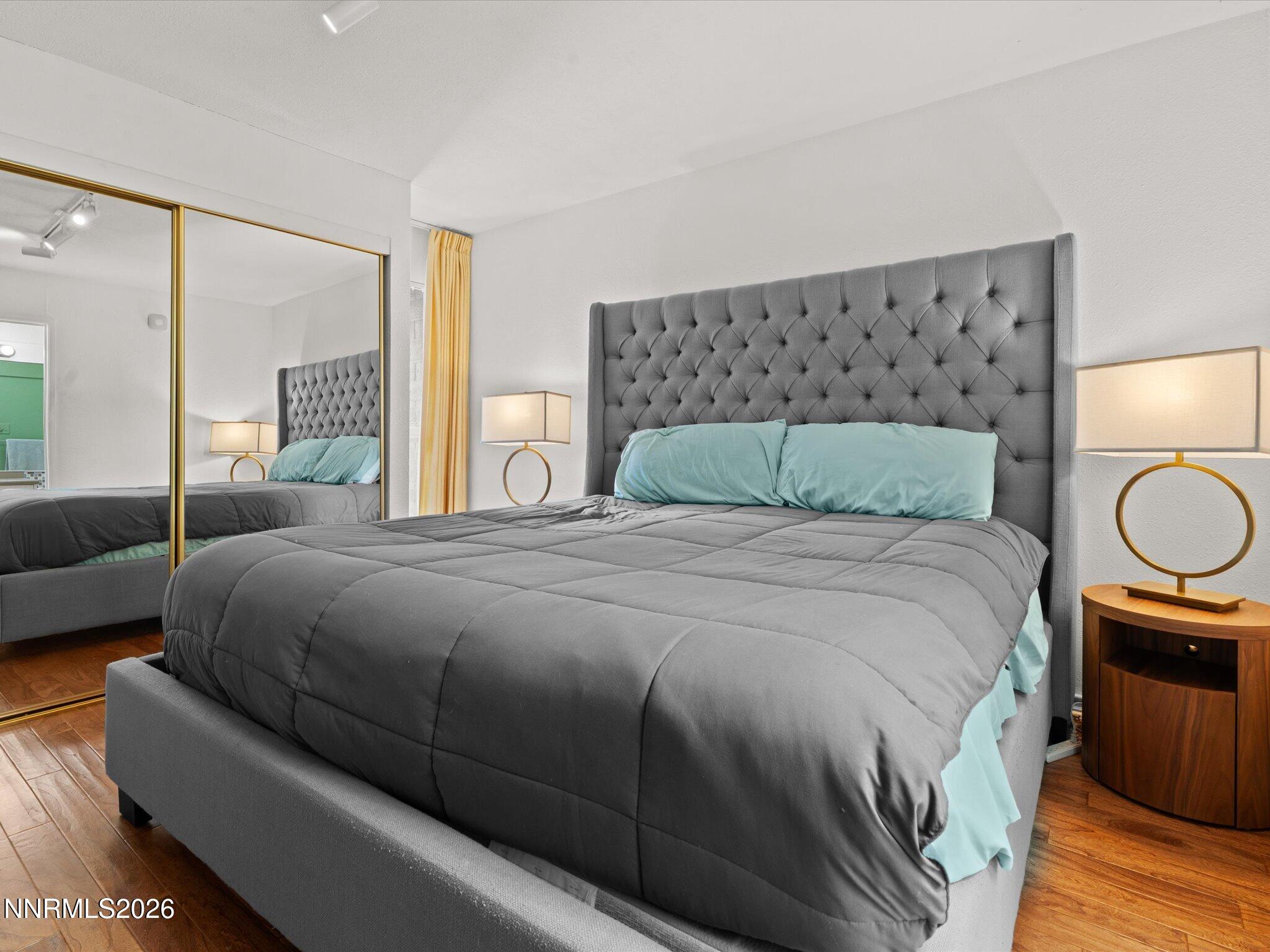 3149 Cashill Boulevard Reno, NV 89509 - Photo 29 of 44 a bedroom with a large bed and a couch