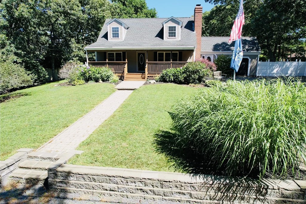 3 Windmill Road Bourne, MA 02532 - Photo 1 of 42 a front view of a house with a yard