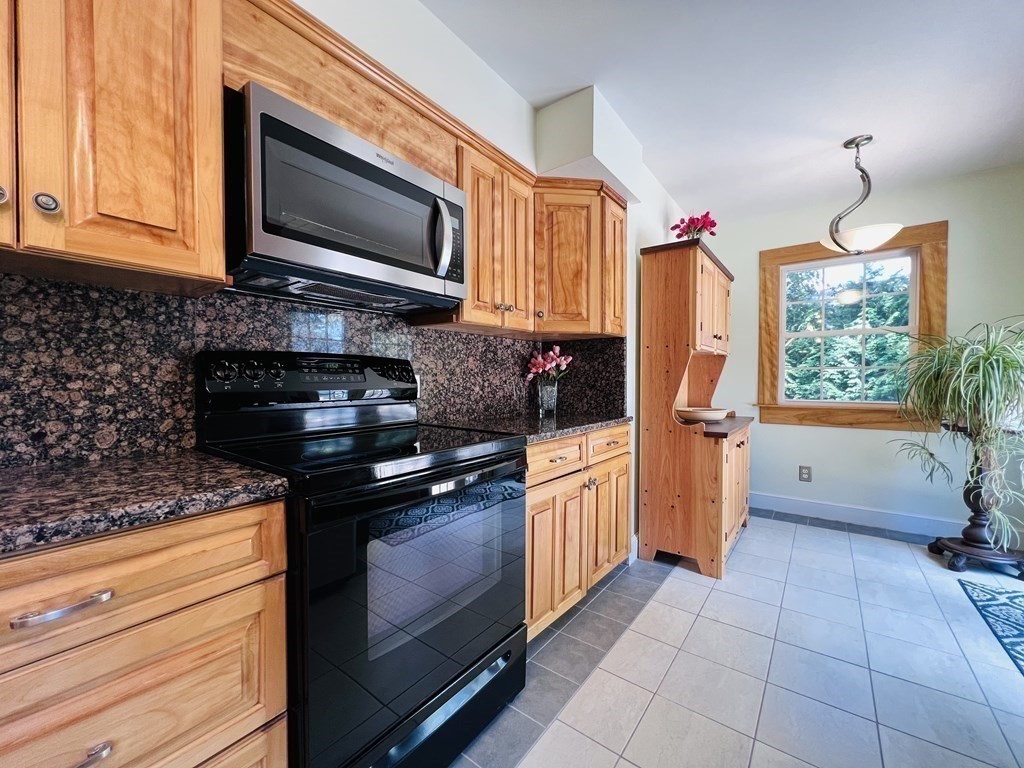 3 Windmill Road Bourne, MA 02532 - Photo 15 of 42 a kitchen with stainless steel appliances granite countertop a stove a sink and a microwave