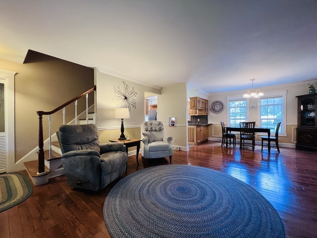 3 Windmill Road Bourne, MA 02532 - Photo 18 of 42 a living room with furniture and a wooden floor