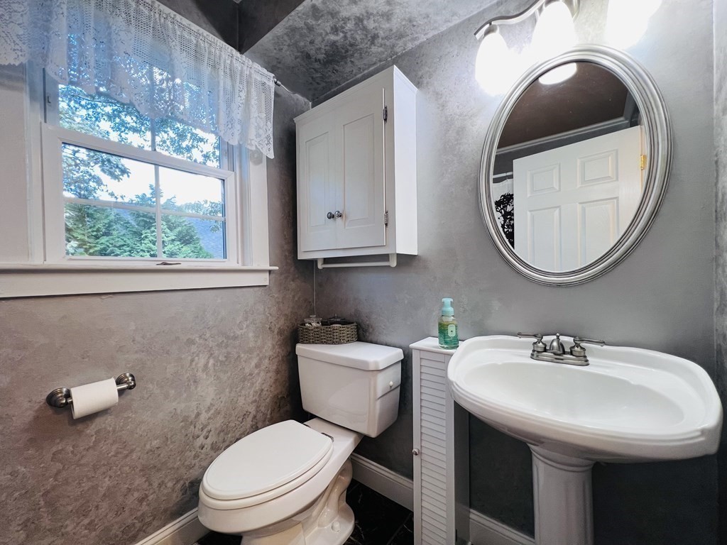 3 Windmill Road Bourne, MA 02532 - Photo 24 of 42 a bathroom with a toilet a sink and a mirror