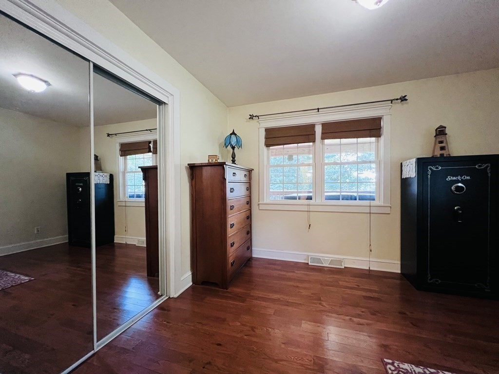 3 Windmill Road Bourne, MA 02532 - Photo 25 of 42 a view of an empty room with wooden floor and a window