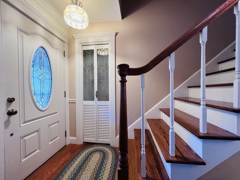 3 Windmill Road Bourne, MA 02532 - Photo 27 of 42 a view of a hallway with wooden floor and staircase