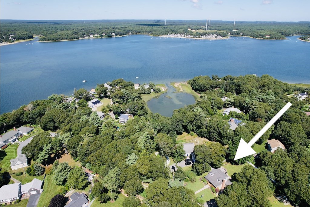 3 Windmill Road Bourne, MA 02532 - Photo 3 of 42 an aerial view of a houses with a lake view