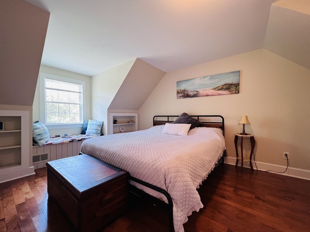 3 Windmill Road Bourne, MA 02532 - Photo 33 of 42 a bedroom with a bed and wooden floor