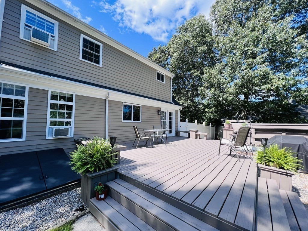 3 Windmill Road Bourne, MA 02532 - Photo 36 of 42 a view of a house with backyard and sitting area