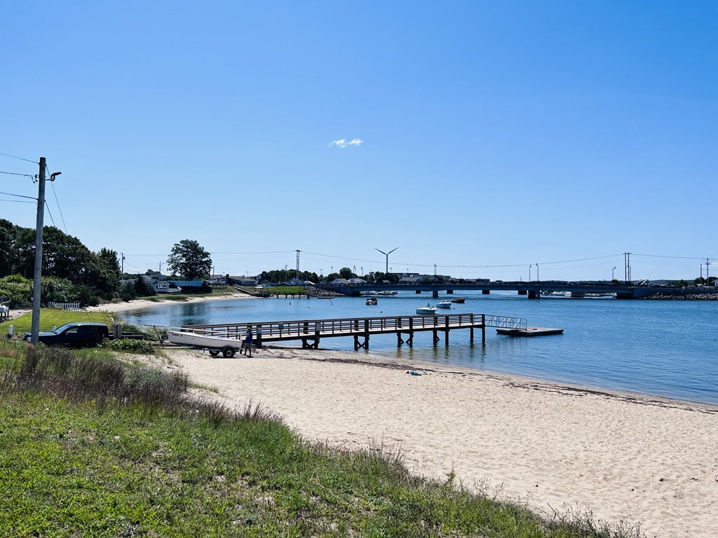 3 Windmill Road Bourne, MA 02532 - Photo 42 of 42 a view of swimming pool with outdoor seating and lake