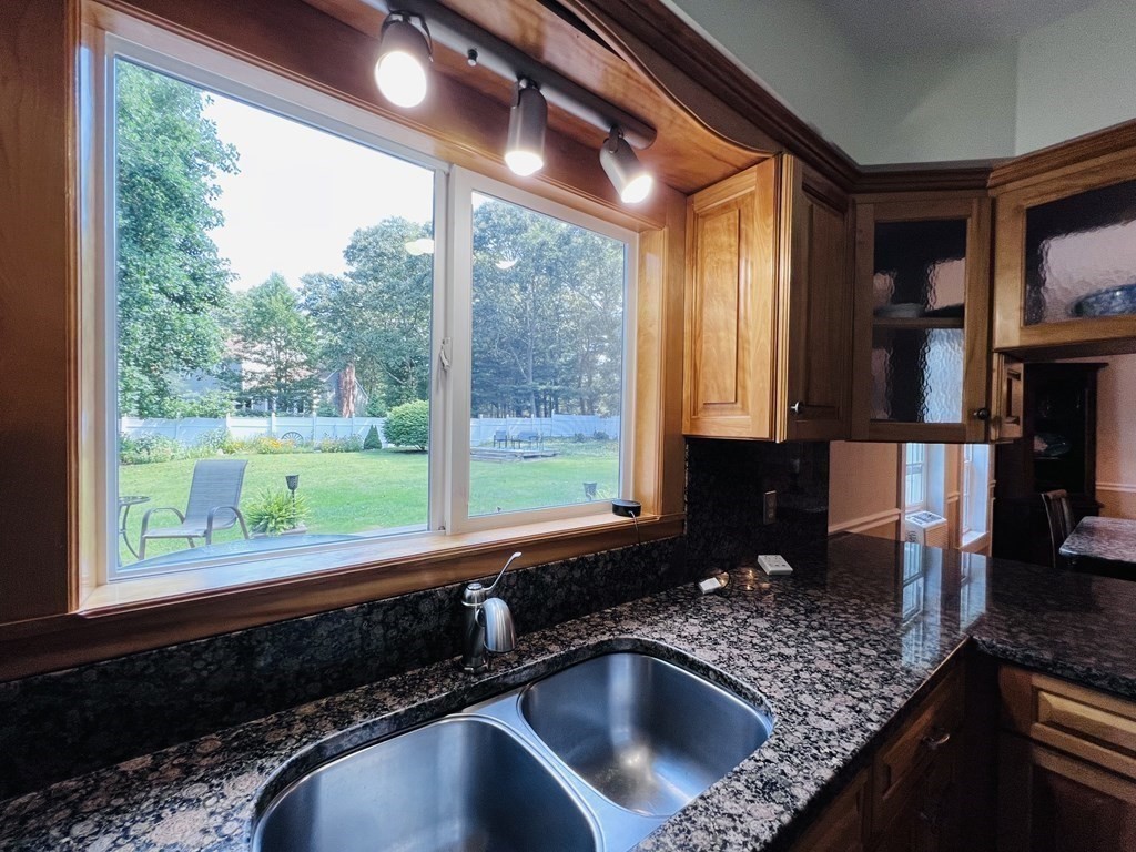3 Windmill Road Bourne, MA 02532 - Photo 7 of 42 a kitchen with granite countertop a sink a counter top space and cabinets