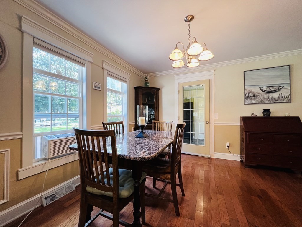 3 Windmill Road Bourne, MA 02532 - Photo 9 of 42 a view of a dining room with furniture window and wooden floor