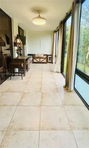 a view of an empty room and a window