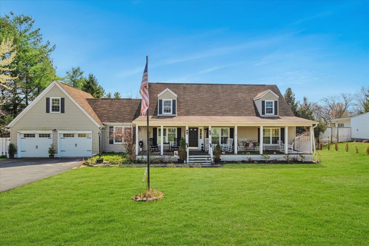 105 Old Castle Point Road Wappingers Falls, NY 12590 - Photo 1 of 1 New england style home with a front yard, driveway, and covered porch