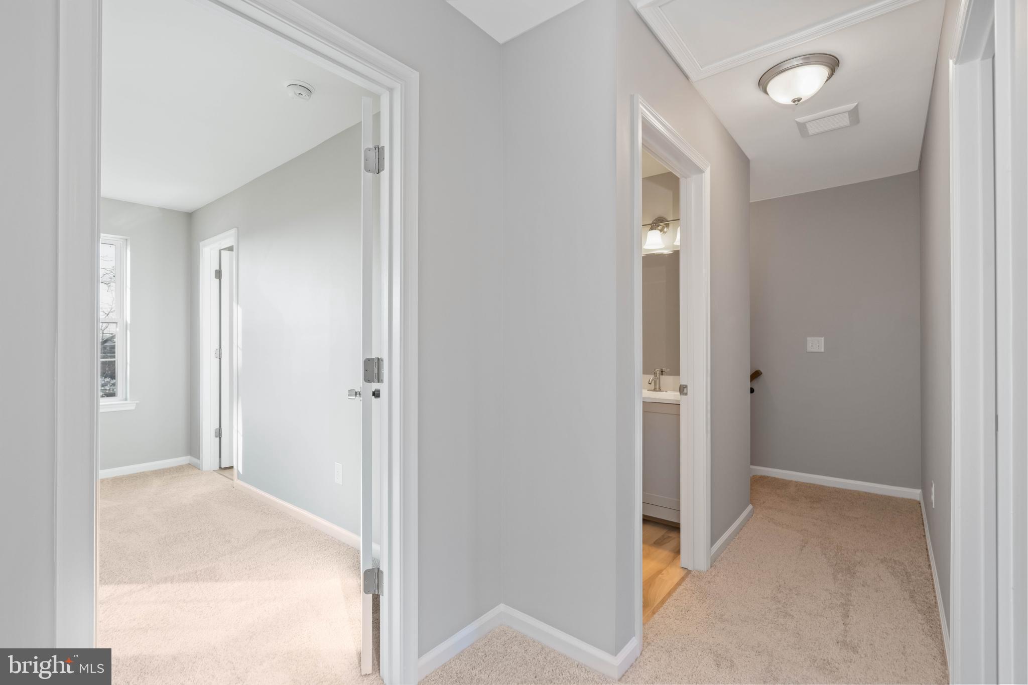 252 Stanger Avenue Glassboro, NJ 08028 - Photo 14 of 27 a view of a bathroom from a hallway