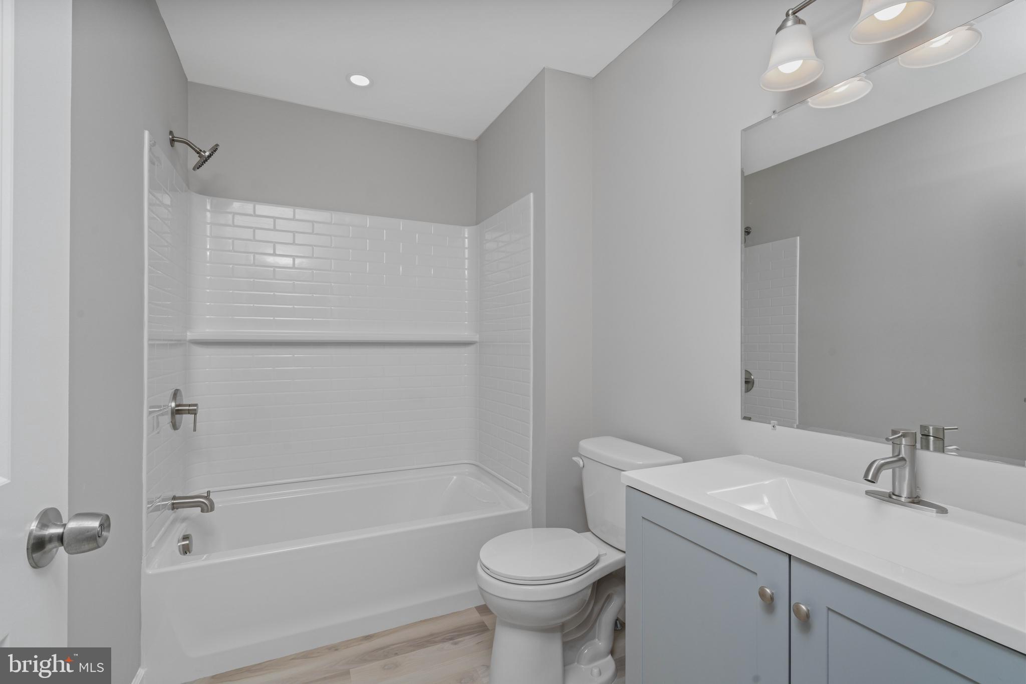 252 Stanger Avenue Glassboro, NJ 08028 - Photo 17 of 27 a bathroom with a sink toilet and shower