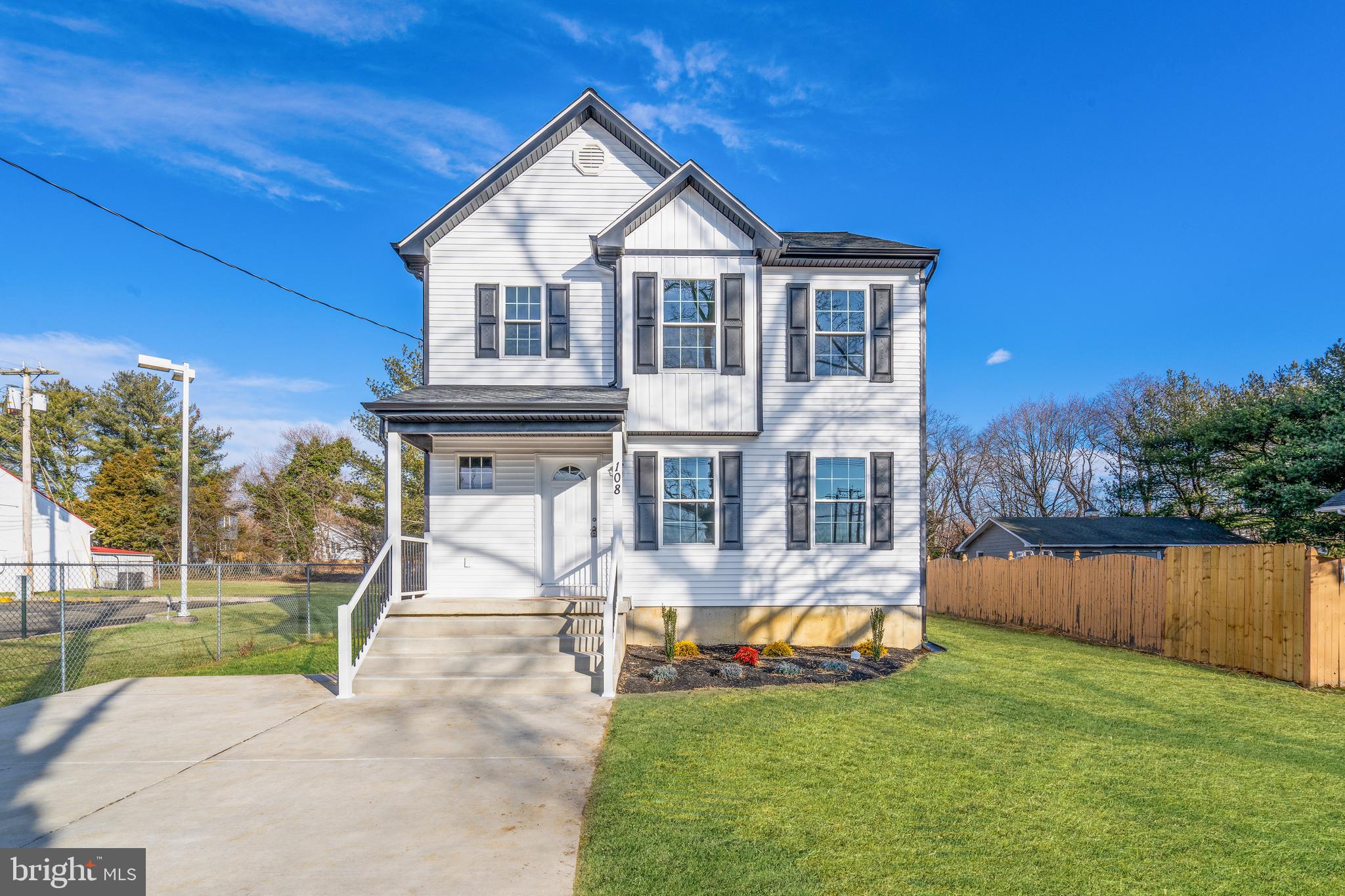 252 Stanger Avenue Glassboro, NJ 08028 - Photo 2 of 27 a front view of a house with a yard table and chairs