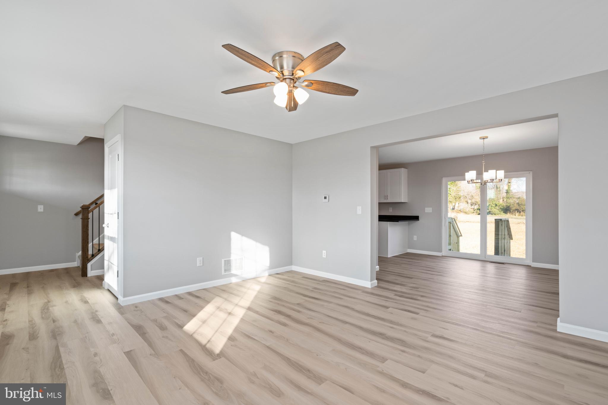 252 Stanger Avenue Glassboro, NJ 08028 - Photo 7 of 27 a view of empty room with wooden floor and fan