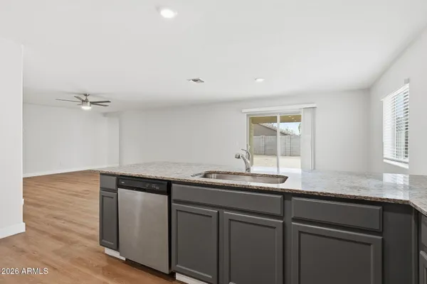 a kitchen with a sink and cabinets