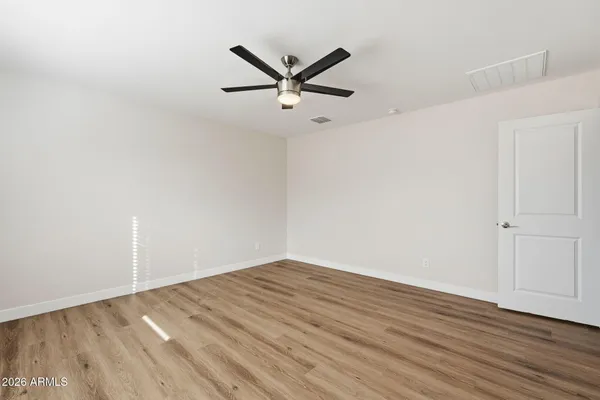 a view of a ceiling fan with wooden floor