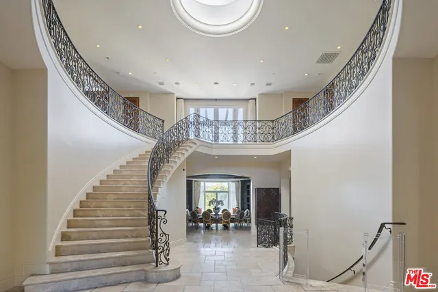 a kitchen with kitchen island a counter top space appliances and a window