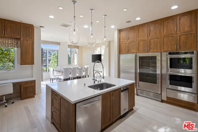 a bedroom with a bed couch and a large window