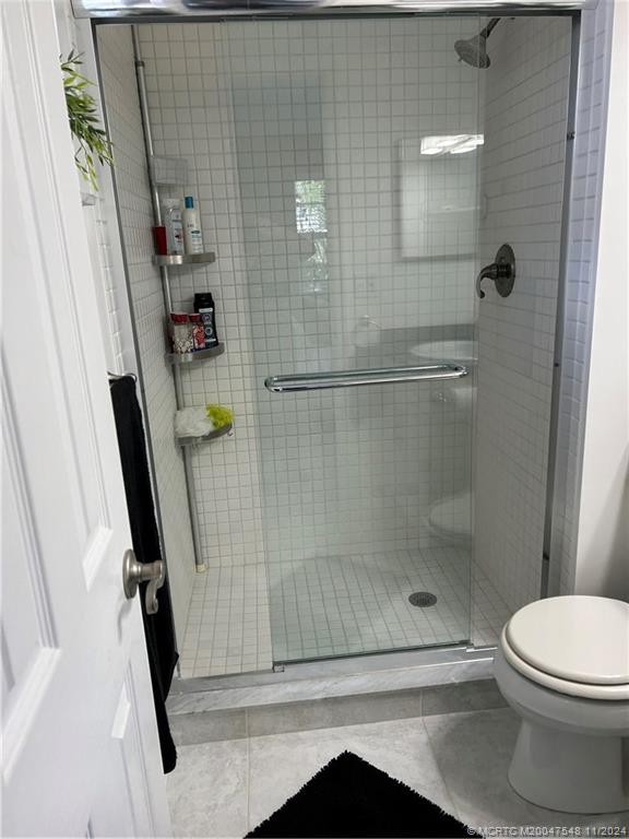 1982 Southwest Palm City Road, Unit J 51 Stuart, FL 34994 - Photo 22 of 39 Master step-in shower