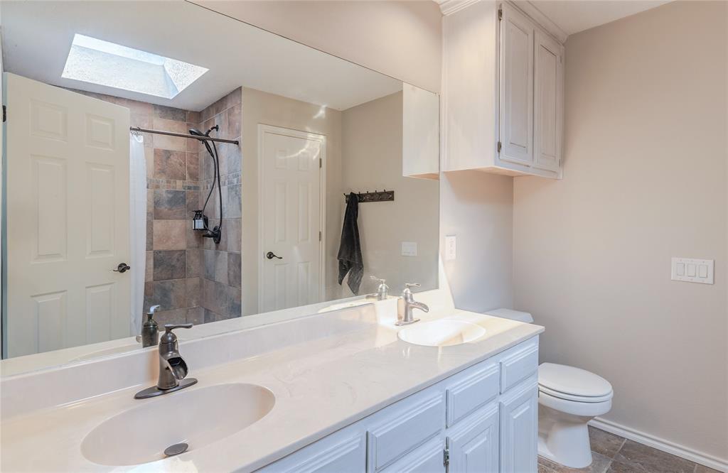 2123 Ridgecliff Drive Keller, TX 76248 - Photo 12 of 19 a bathroom with a sink a toilet and shower