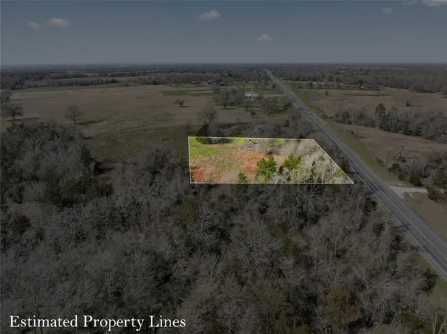 a view of a city and green space