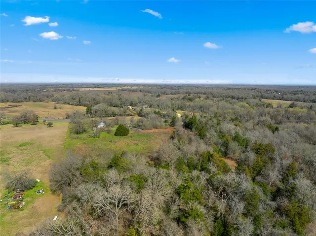 a view of a lake with green field