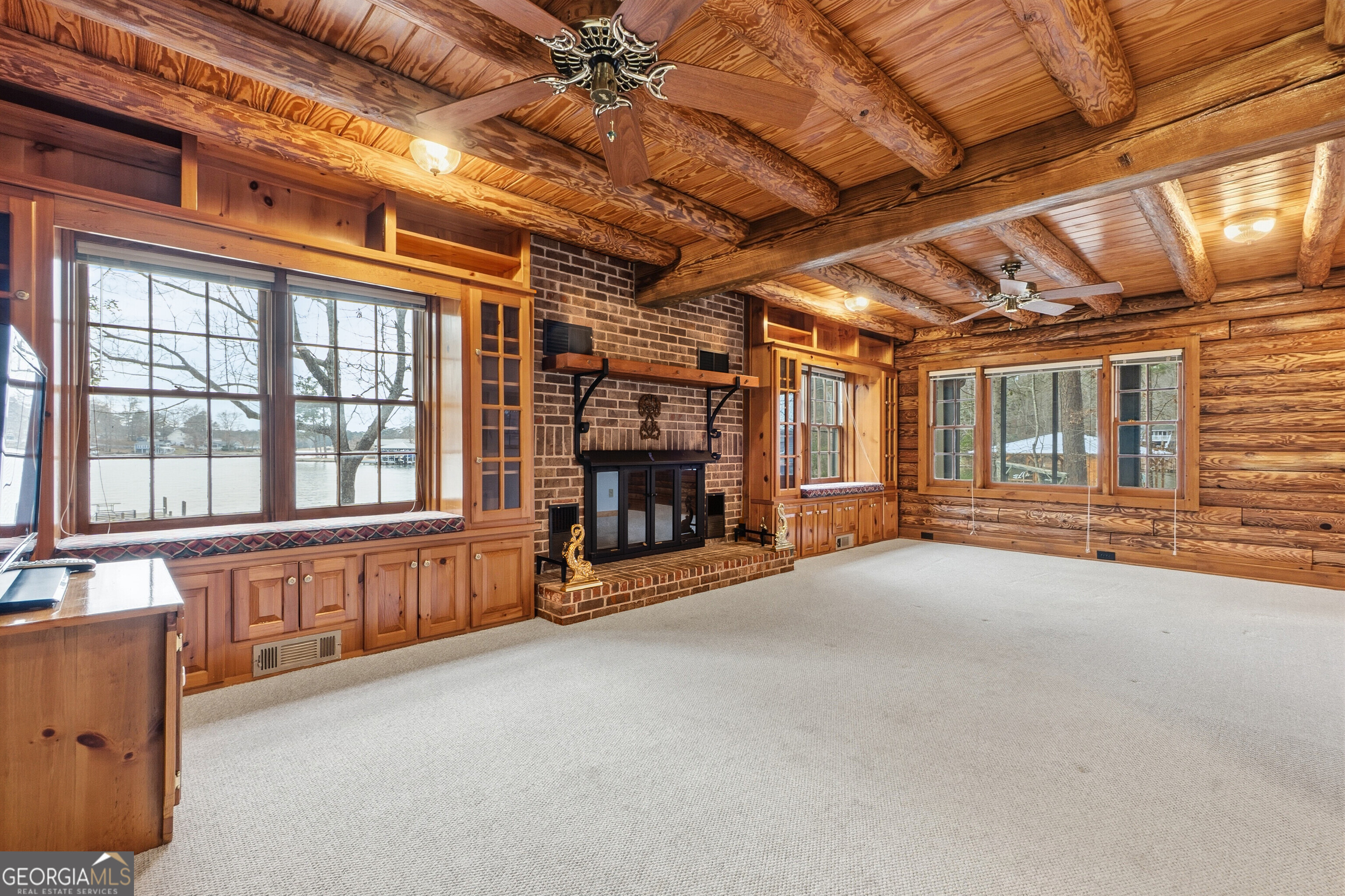 324 Blenny Run Jackson, GA 30233 - Photo 16 of 71 a view of an empty room with wooden floor and a window