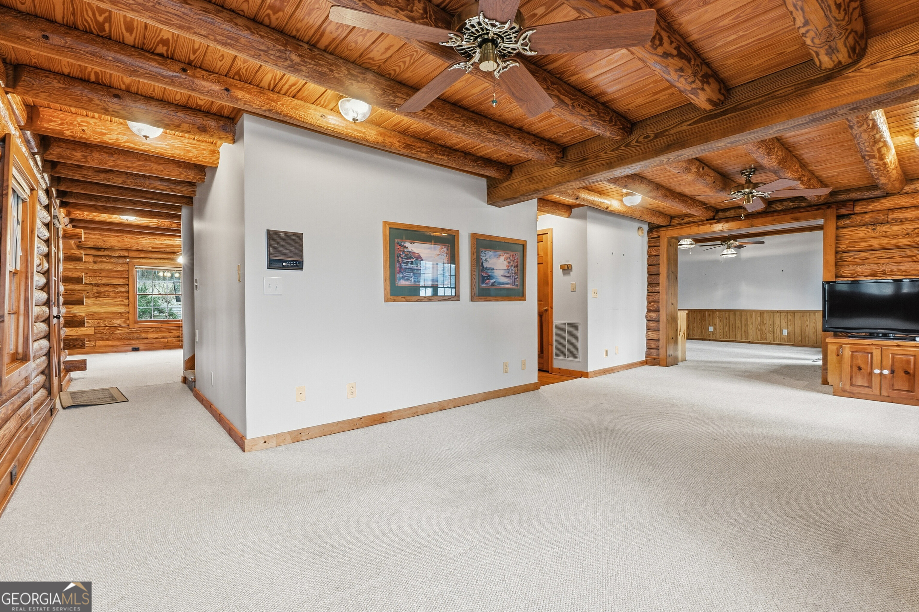 324 Blenny Run Jackson, GA 30233 - Photo 17 of 71 a view of a livingroom with an empty space and a garage