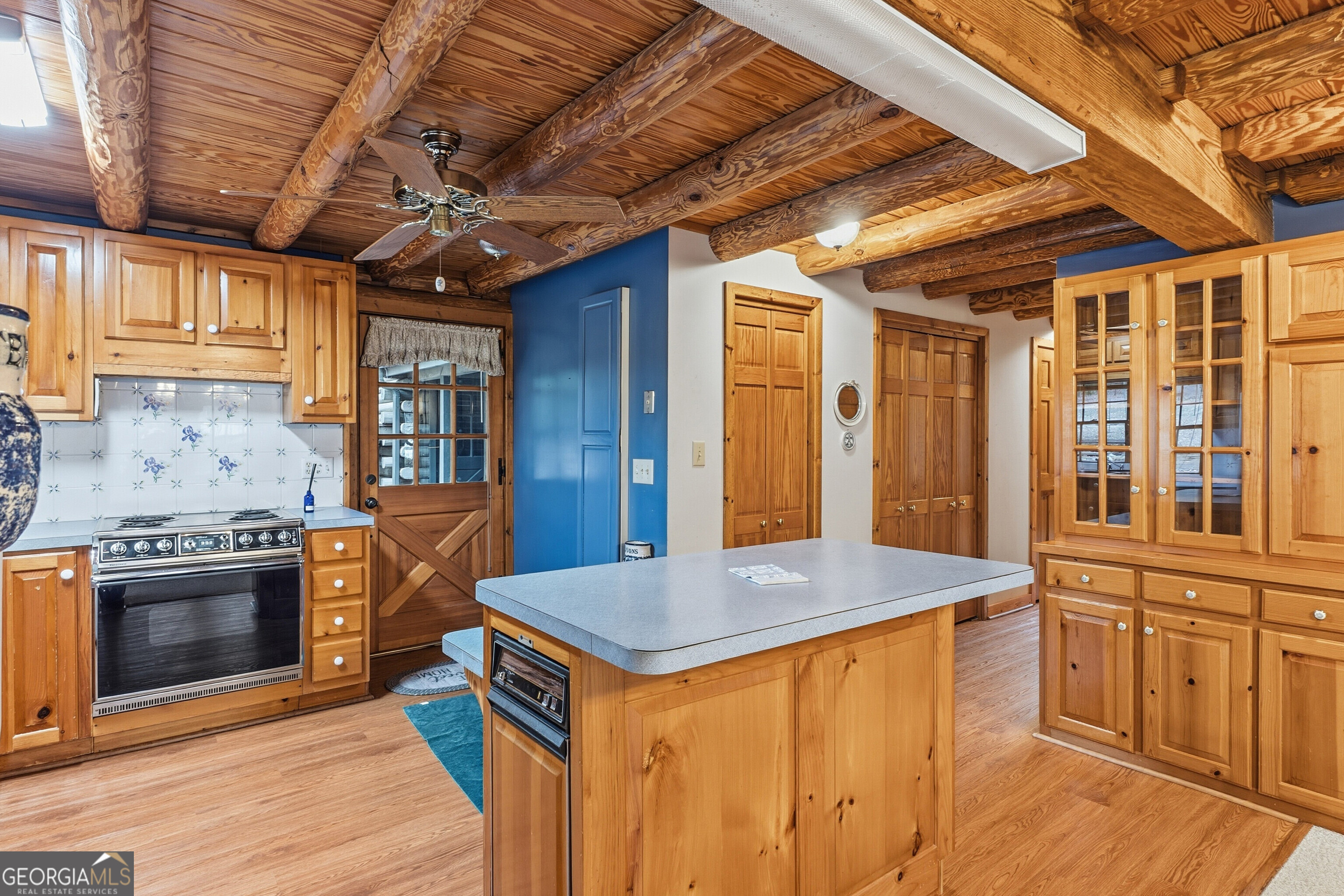 324 Blenny Run Jackson, GA 30233 - Photo 26 of 71 a kitchen with stainless steel appliances granite countertop a stove a sink and a refrigerator