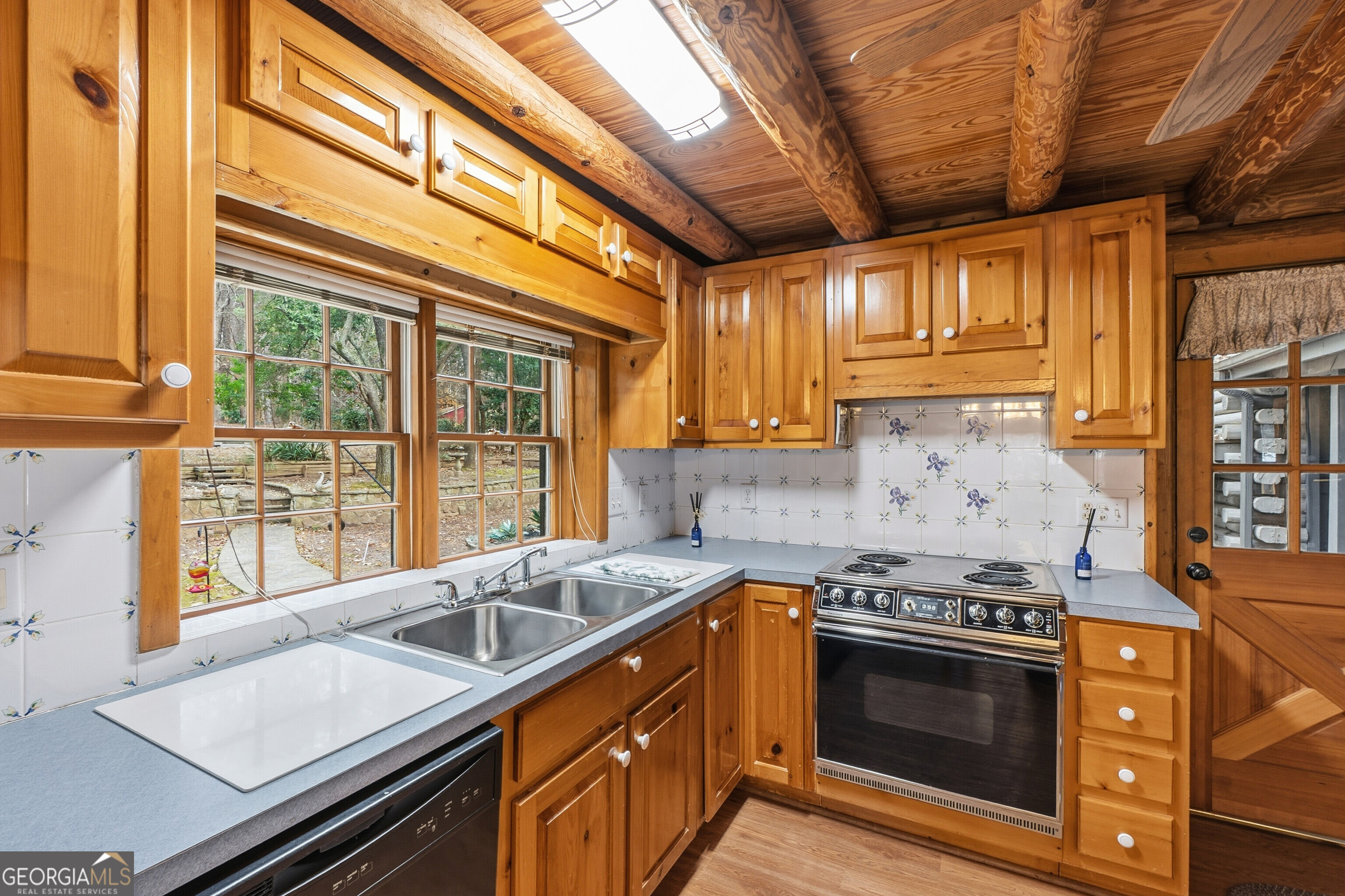 324 Blenny Run Jackson, GA 30233 - Photo 29 of 71 a kitchen with a stove and a sink