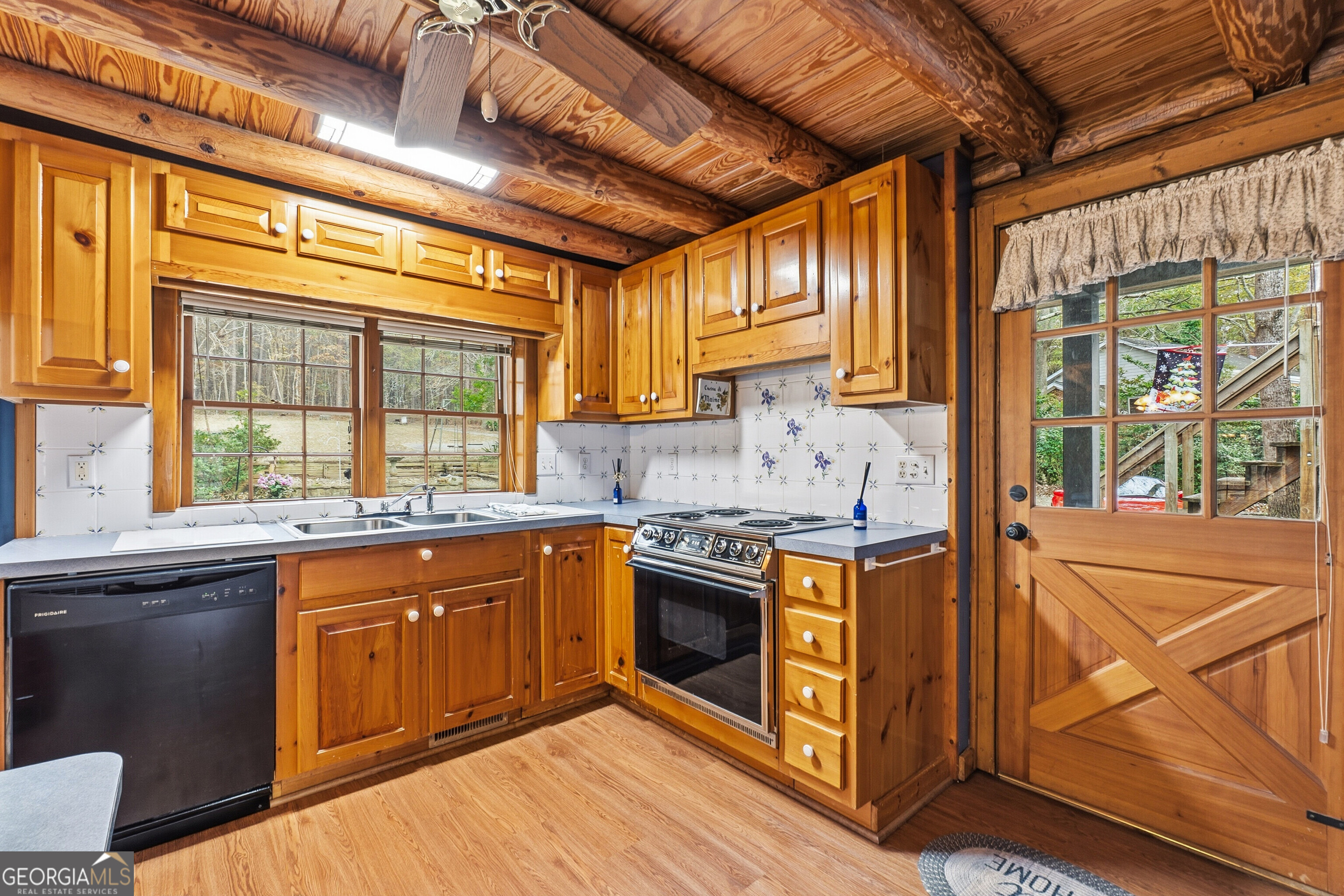 324 Blenny Run Jackson, GA 30233 - Photo 30 of 71 a kitchen with stainless steel appliances granite countertop a stove a sink and a microwave