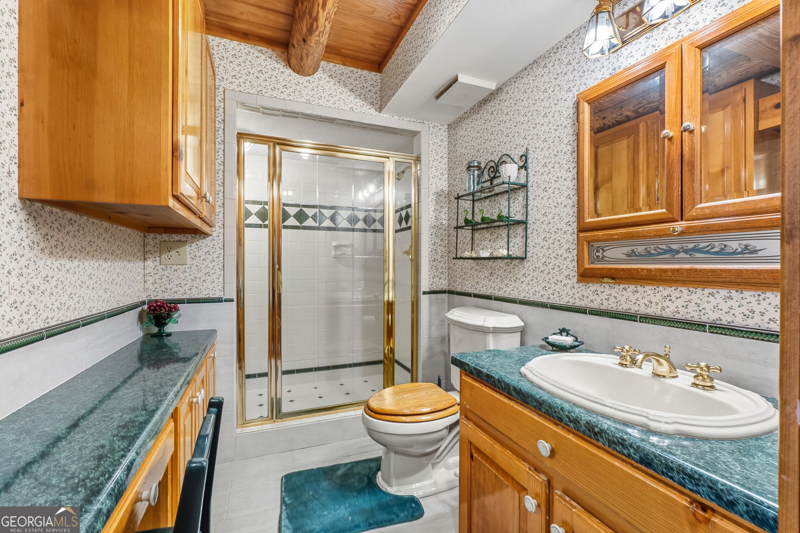 324 Blenny Run Jackson, GA 30233 - Photo 40 of 71 a bathroom with a granite countertop sink toilet and shower