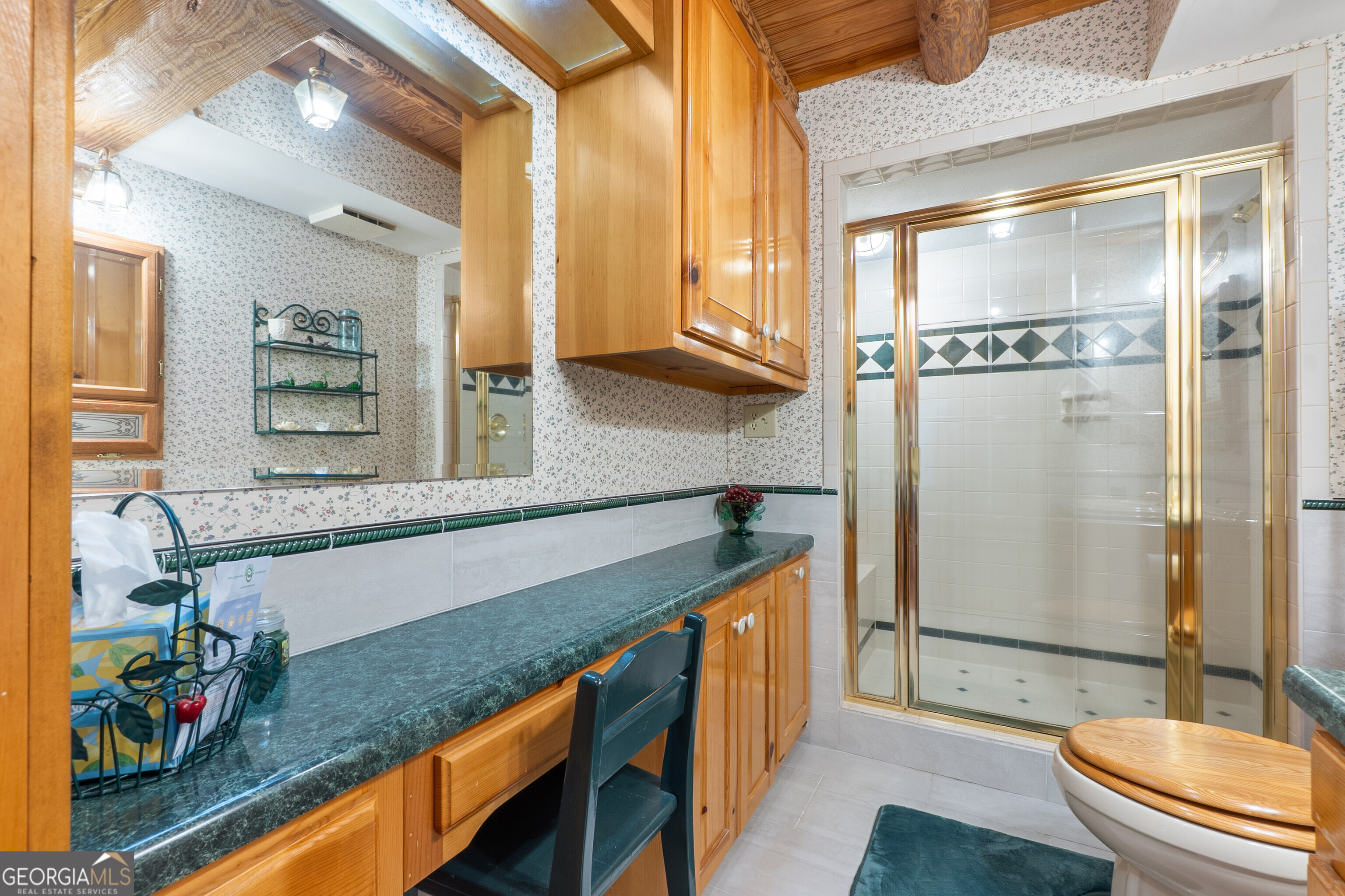324 Blenny Run Jackson, GA 30233 - Photo 41 of 71 a bathroom with a granite countertop sink a mirror and a bathtub