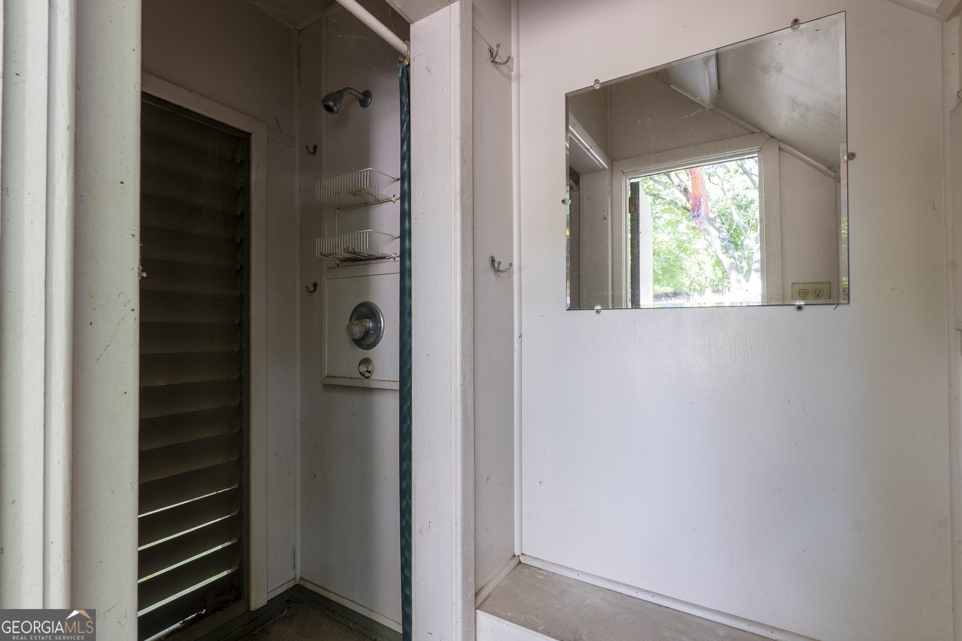 324 Blenny Run Jackson, GA 30233 - Photo 52 of 71 a bathroom with a shower and a window