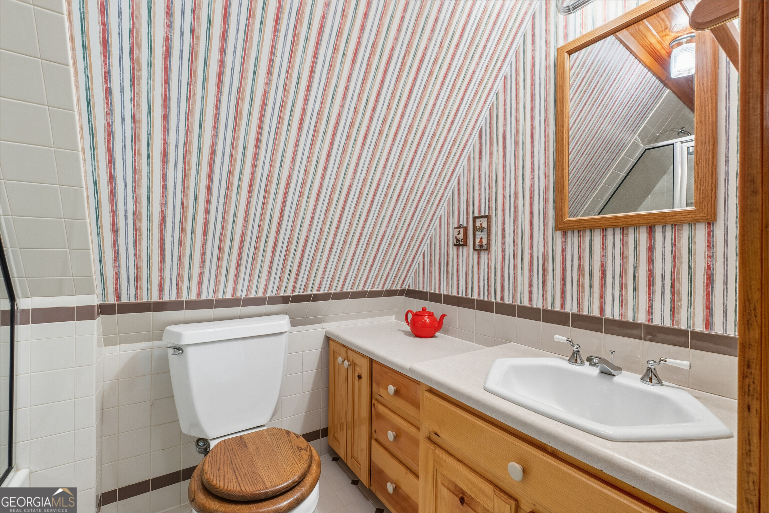 324 Blenny Run Jackson, GA 30233 - Photo 59 of 71 a bathroom with a sink and a toilet