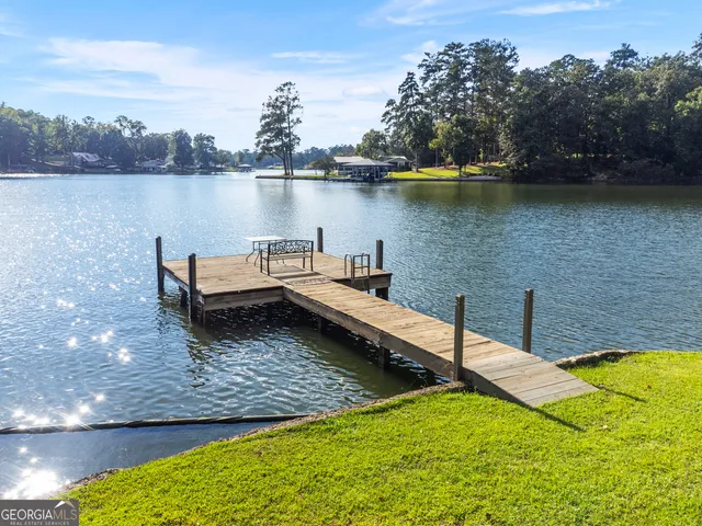 a view of a lake with houses in the back