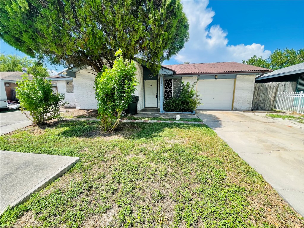 a house with huge green field in front of it