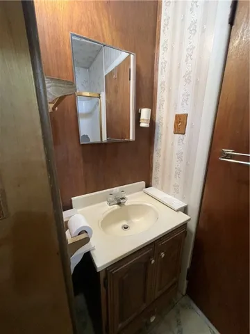 a bathroom with a sink and a mirror