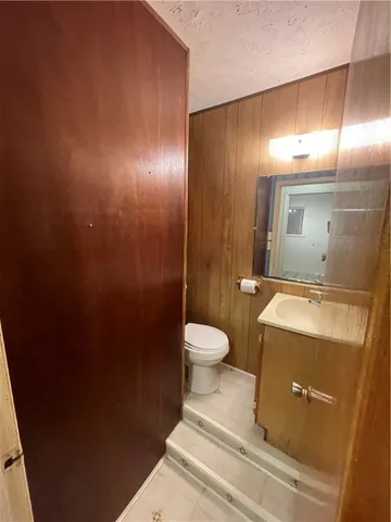 a bathroom with a toilet and a sink