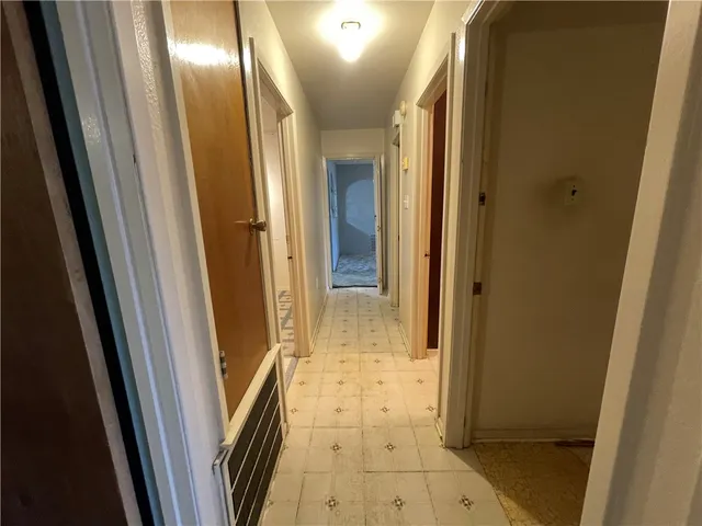 a view of hallway with a mirror