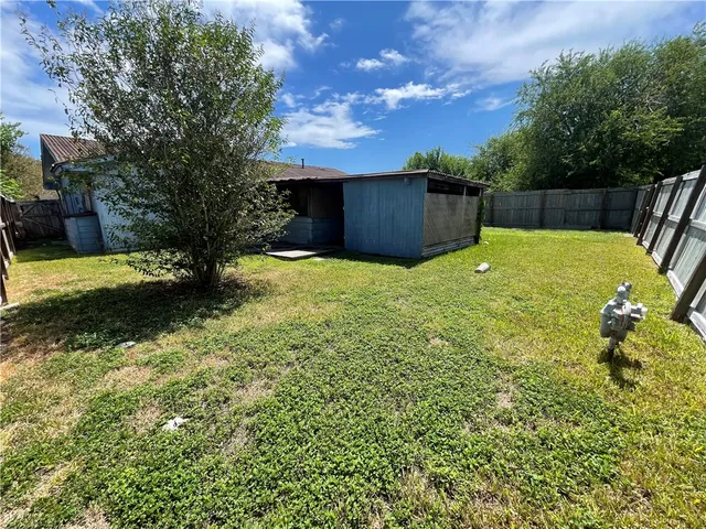 a backyard of a house with lots of green space