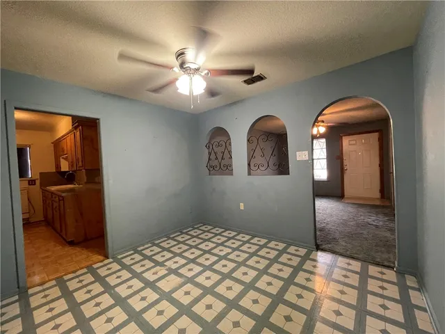 a bedroom with a bed and a view of en suite bathroom