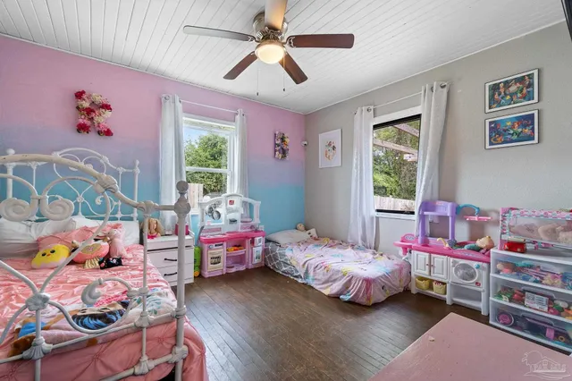 a bedroom with bed and a window