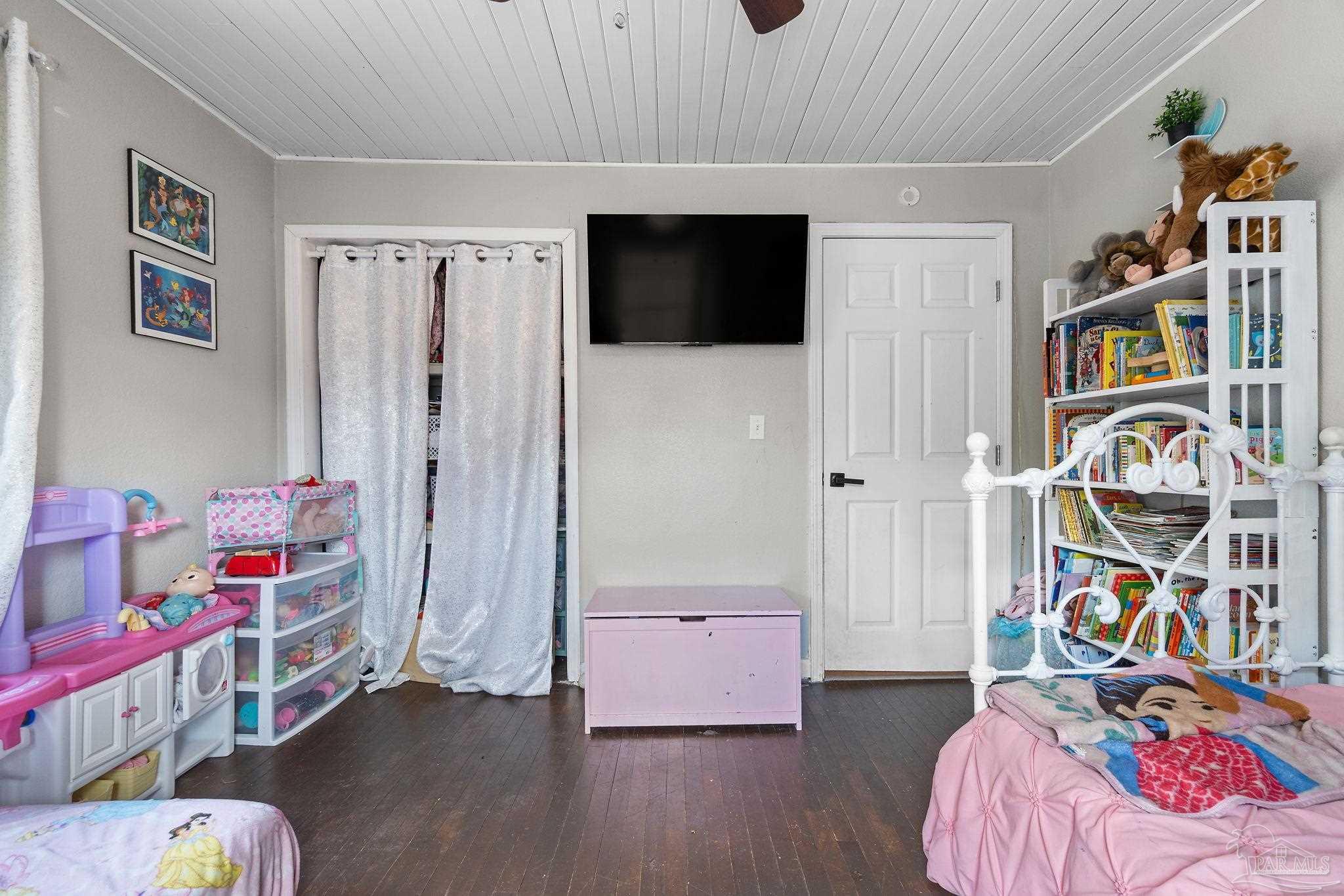 10610 Chemstrand Road Pensacola, FL 32514 - Photo 19 of 42 a bedroom with furniture and a book shelf