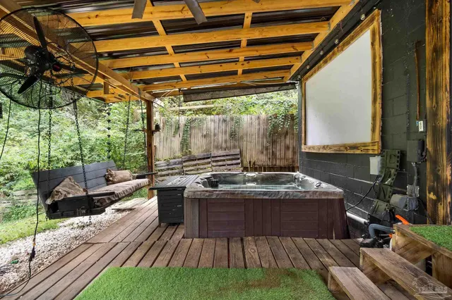 a view of a kitchen with a sink and wooden floor