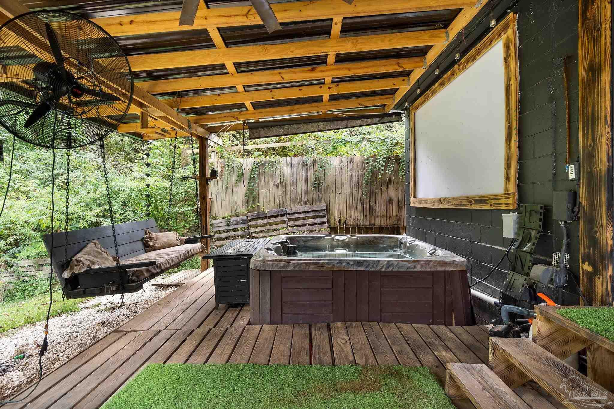 10610 Chemstrand Road Pensacola, FL 32514 - Photo 27 of 42 a view of a kitchen with a sink and wooden floor